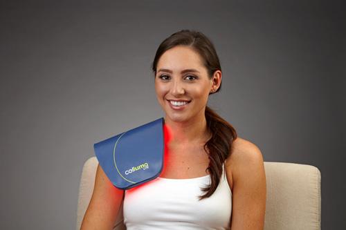 Woman using Celluma Light Therapy for Shoulder