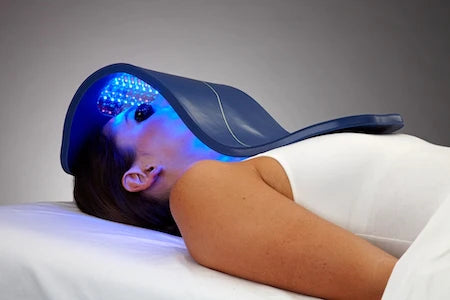 Woman using LED Light Therapy Device