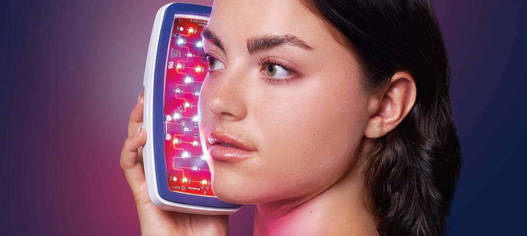 Woman using the all new Celluma POD device