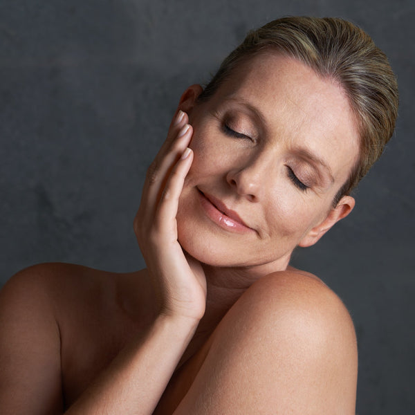 Woman touching her skin