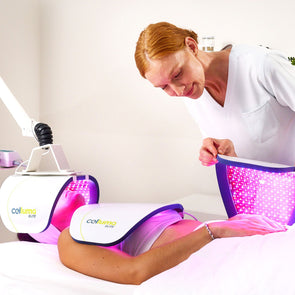 Patient getting a red light therapy treatment with the professional-grade Celluma ELITE 3 panel system on the wrinkles mode and getting assisted by a licensed professional.