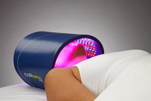 Woman using Celluma PRO light therapy device